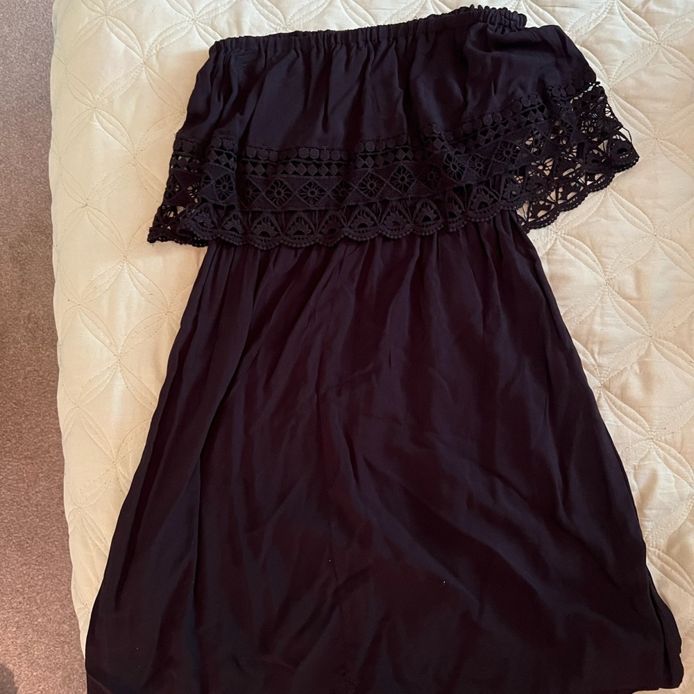 Black strapless sundress with detail.